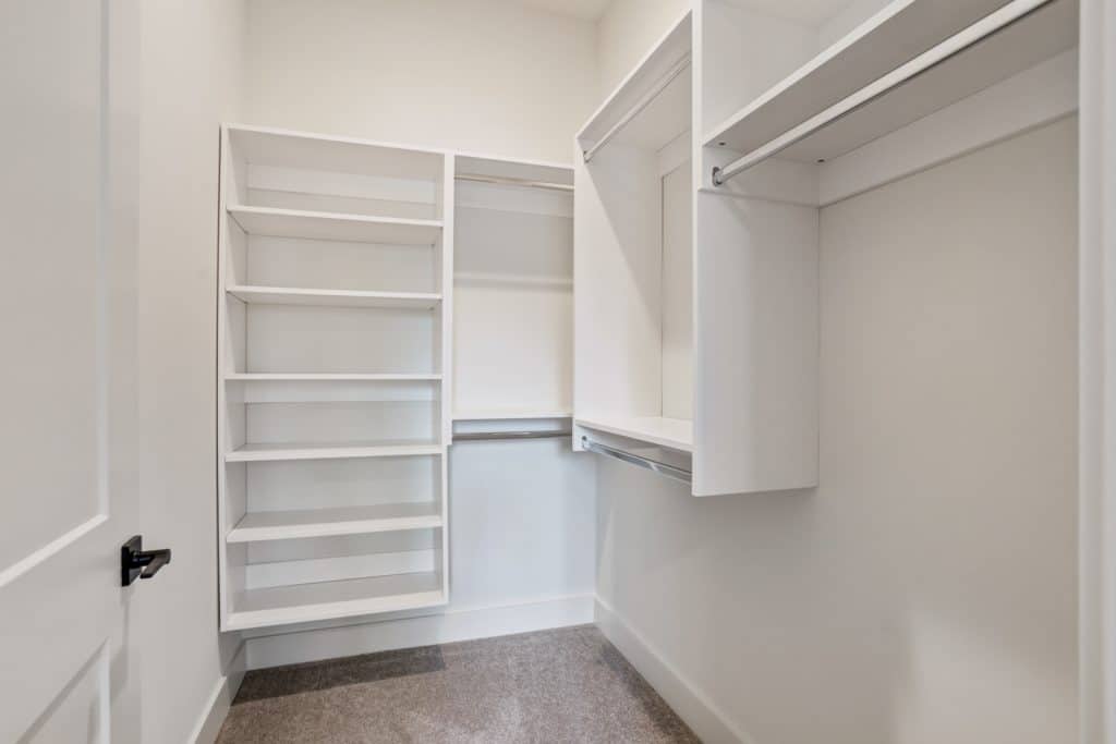 Margaux Midtown apartment walk-in closet with shelving