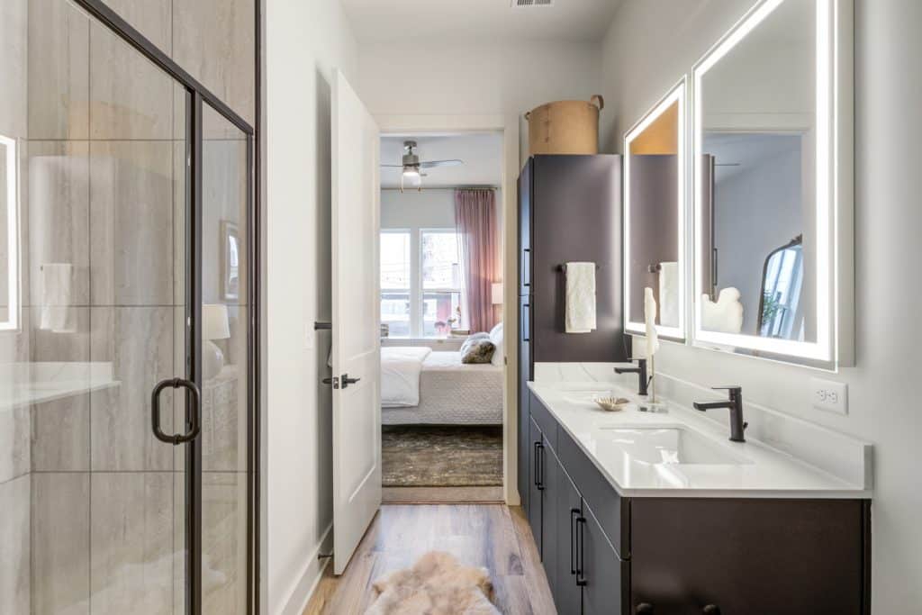 Double vanities in modern apartment bathrooms at Margaux Midtown