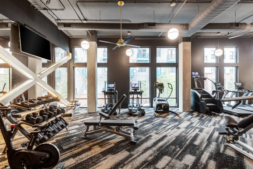 Modern fully-equipped fitness center at Margaux Midtown